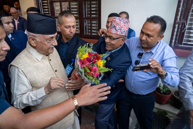 Khadga Prasad Oli the chairman of the Communist Party of Nepal leaves his residence to meet his supporters 