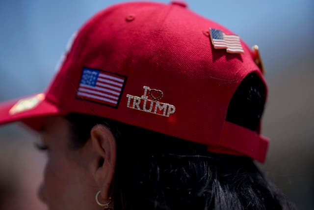 A close-up of a Maga hat worn by a Trump supporter