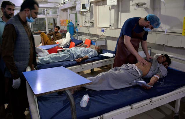 Injured victims of a rain storm are treated at a hospital