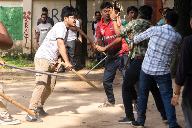 Students clash during a protest at Jahangir Nagar University in Savar, outside Dhaka,