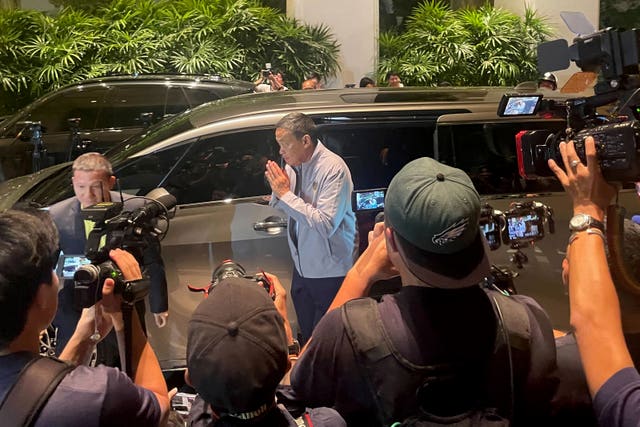 Thai Prime Minister Surendra Thavisin speaks to media outside a hotel in Bangkok