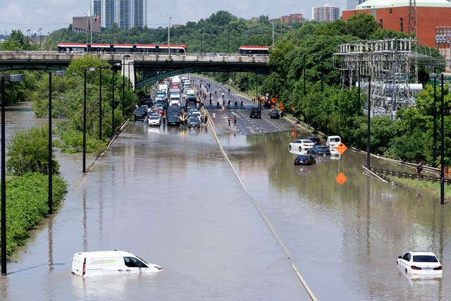 Cars partially submerged in flood waters in Toronto