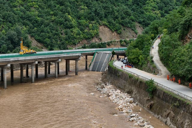 Rescuers work near a collapsed bridge in China 