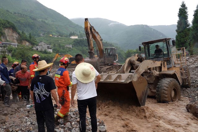 Rescue workers operator heavy diggers