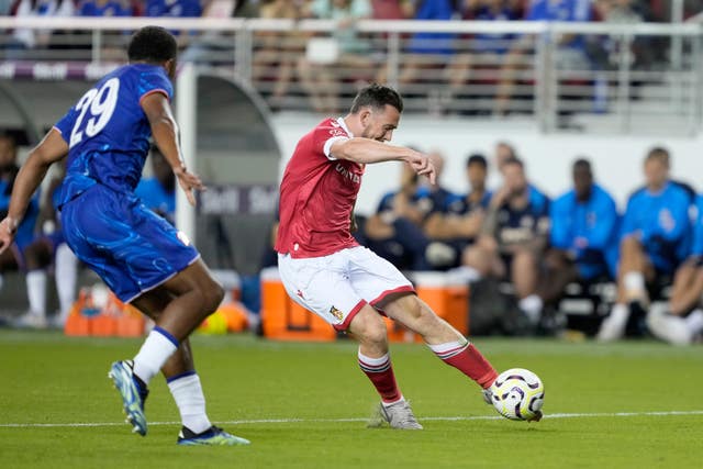 Wrexham forward Jack Marriott shoots left-footed Chelsea defender Wesley Fofana