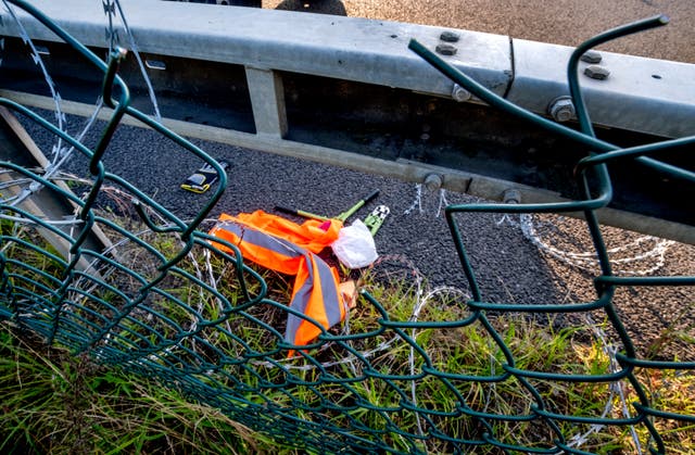 Equipment left behind after a hole was cut in a fence