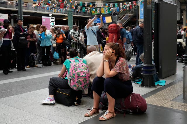 A passenger waits inside Gare du Nord 
