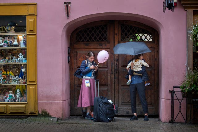 People shelter from the rain in Vilnius, Lithuania 