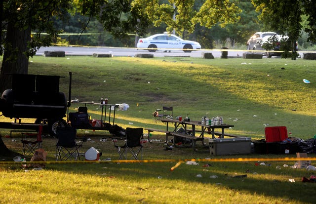 Debris is strewn about as police tape seals off an area of Maplewood Park, Rochester, New York 