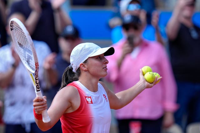 Iga Swiatek reacts to winning bronze