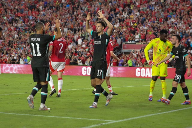 Liverpool midfielder Curtis Jones celebrates his goal with forward Mohamed Salah