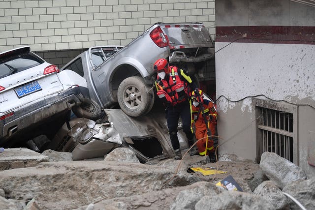 Rrescuers work in the aftermath of flash floods in Ridi Village, Kangding City