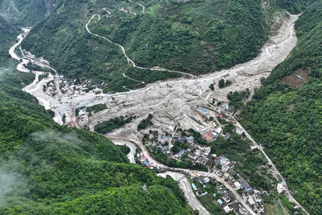 The impact of flash floods and mudslides can be seen near Ridi Village, Kangding City