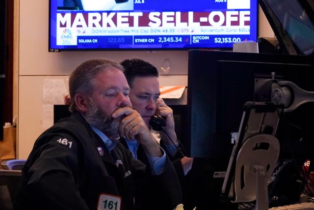 Two men in front of a monitoring screen