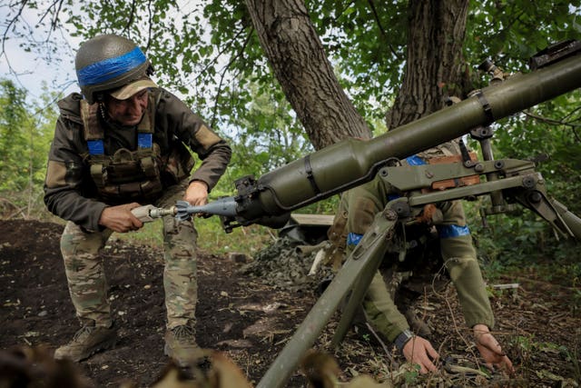 A Ukrainian serviceman of the 24th Mechanised Brigade fires an Easel Antitank Grenade Launcher SPG9 towards Russian position at Chasiv Yar, Donetsk 