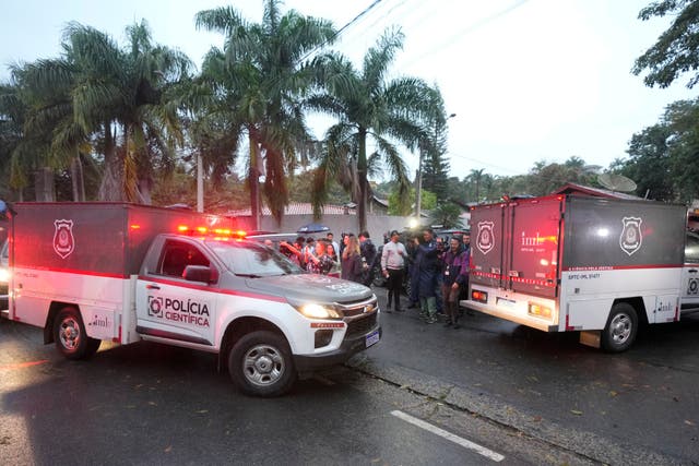 Police vehicles arrive at the gated community where a plane crashed in Vinhedo, Sao Paulo state, Brazil