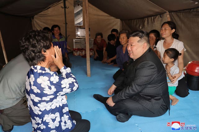 The North Korean leader visits people hit by flooding