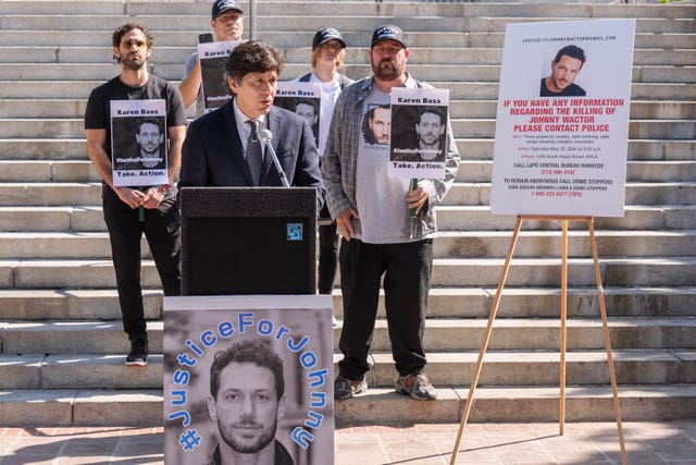 Los Angeles Council member Kevin de Leon, surrounded by friends of late actor Johnny Wactor, pictured, speaks during a news conference outside Los Angeles City Hall, in Los Angeles on Tuesday