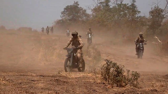 A marine assault team members ride motorcycles toward Ukrainian position at an undisclosed location 