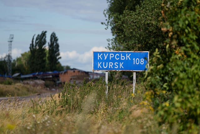 A sign that reads 'Kursk 108 km' is seen on the Russian-Ukrainian border in the Sumy region, Ukraine