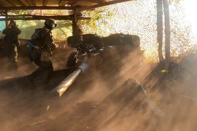 A Russian soldier fires a Rapira anti-tank gun in the border area of the Kursk region, Russia 