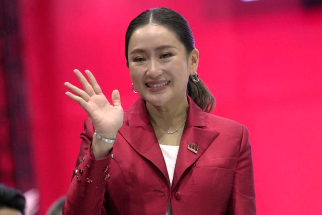 Paetongtarn Shinawatra waves at the camera