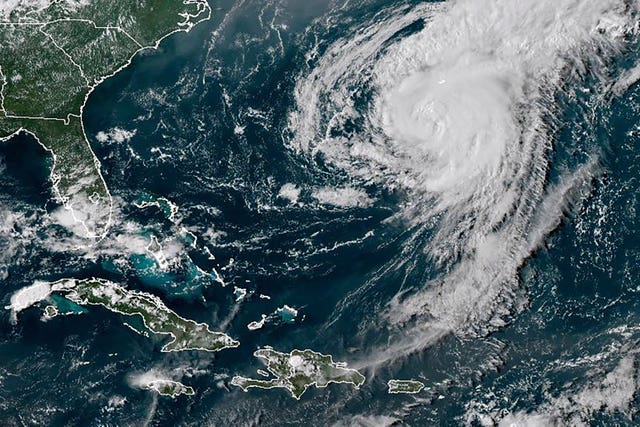 A satellite image shows Hurricane Ernesto in the Atlantic Ocean south-southwest of Bermuda 