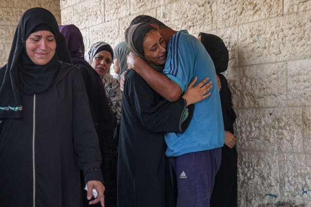 Palestinians grieve at the funeral for more than 15 people killed in an Israeli strike, at Al-Aqsa Martyrs Hospital in Deir al-Balah