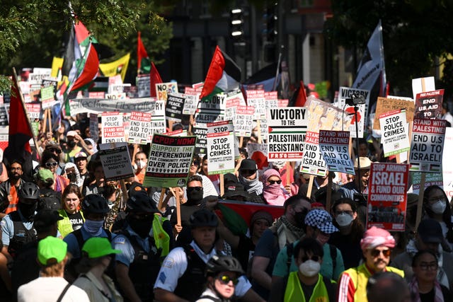 Protesters march to the Democratic National Convention after a rally at Union Park 