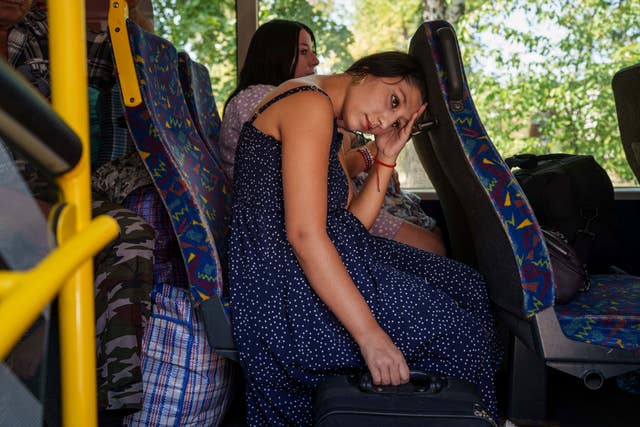 A woman sits on a bus during evacuation in Pokrovsk, Donetsk region, Ukraine