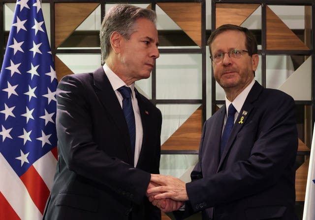 US Secretary of State Antony Blinken, left, meets with Israel’s President Isaac Herzog, in Tel Aviv, Israel