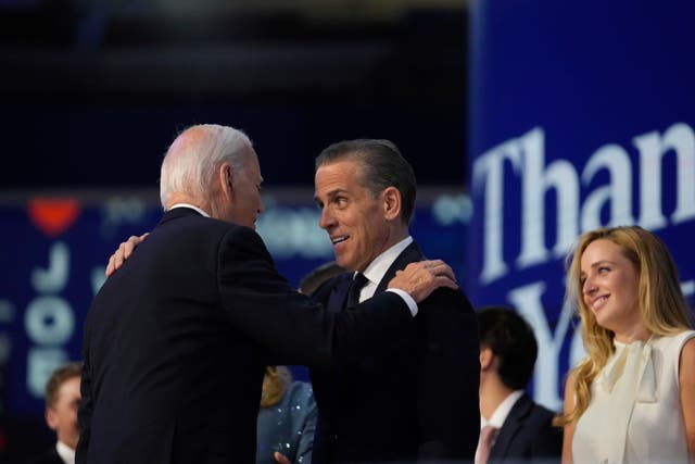 US President Joe Biden hugs his son Hunter Biden during the Democratic National Convention