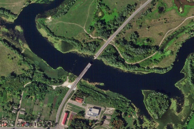 Satellite photo from Planet Labs PBC shows a destroyed bridge across the Seim River at the town of Glushkovo