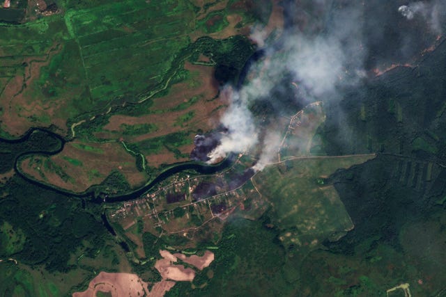 This satellite image released by Planet Labs PBC shows fires near the village of Krasnooktyabrskoe in Russia’s Kursk region 