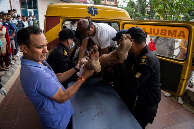 An injured man is taken to hospital for treatment