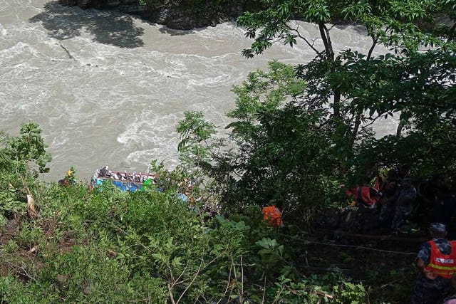 Rescuers above a river near Abukhaireni town