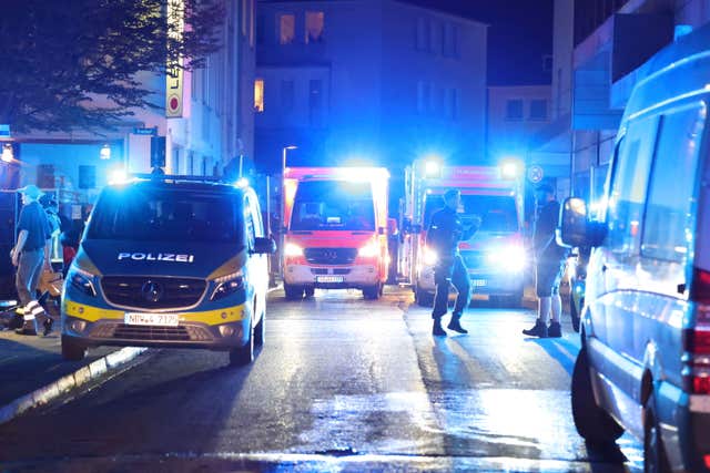 Police and ambulances near the scene where people were killed and injured in an attack at a festival in Solingen, western Germany