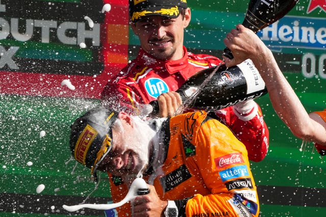 Norris is sprayed with champagne after his triumph