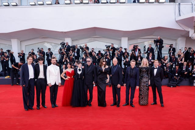 Jeremy Kleiner, Arthur Conti, Justin Theroux, Jenna Ortega, Winona Ryder, Tim Burton, Monica Bellucci, Michael Keaton, Willem Dafoe, Catherine O’Hara and producer Tommy Harper pose for photographers