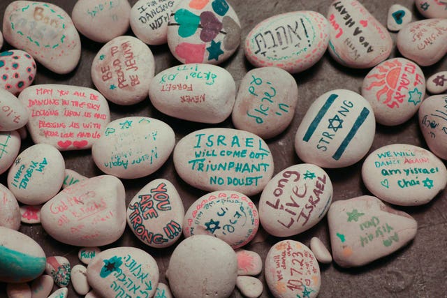 Decorated stones are seen during a vigil 