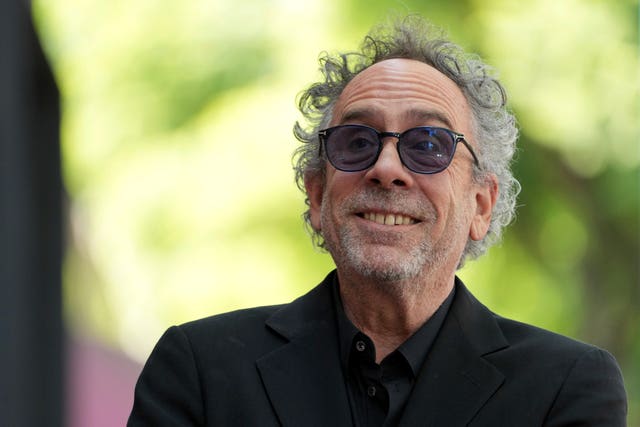 Tim Burton arrives at a ceremony honouring him with a star on the Hollywood Walk of Fame