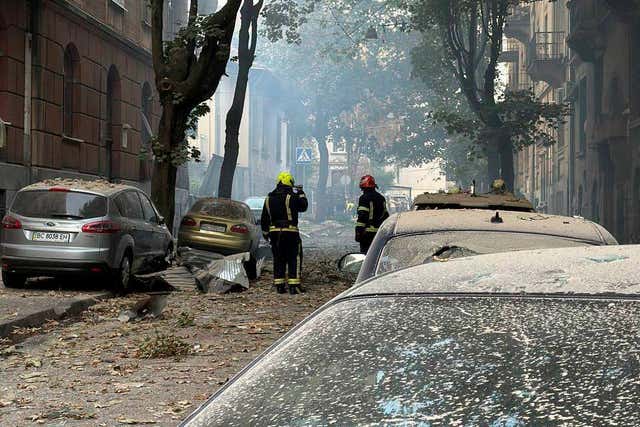 Cars and buildings damaged by a drone strike in Lviv