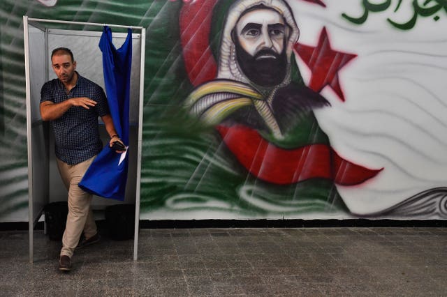 A voter leaves a polling station