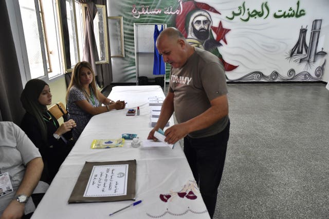 A voter casts a ballot