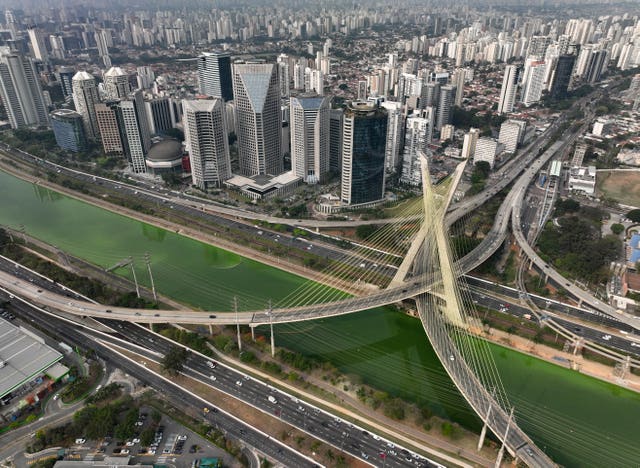 The Pinheiros River is green in Sao Paulo, Brazil 