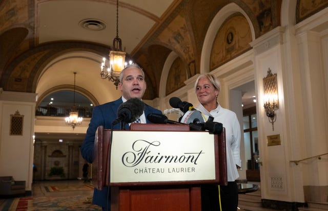 Fairmont Chateau Laurier general manager Genevieve Dumas looks on as Ottawa police detective Akiva Gellar speaks about the stolen portrait of Winston Churchill 