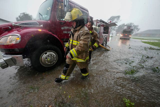 Morgan City firefighters respond to a home fire during Hurricane Francine in Morgan City, Louisiana 