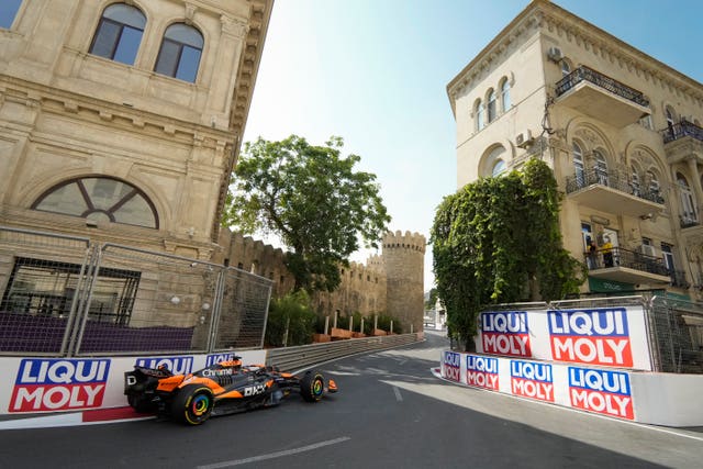 Oscar Piastri drives through Baku's castle section