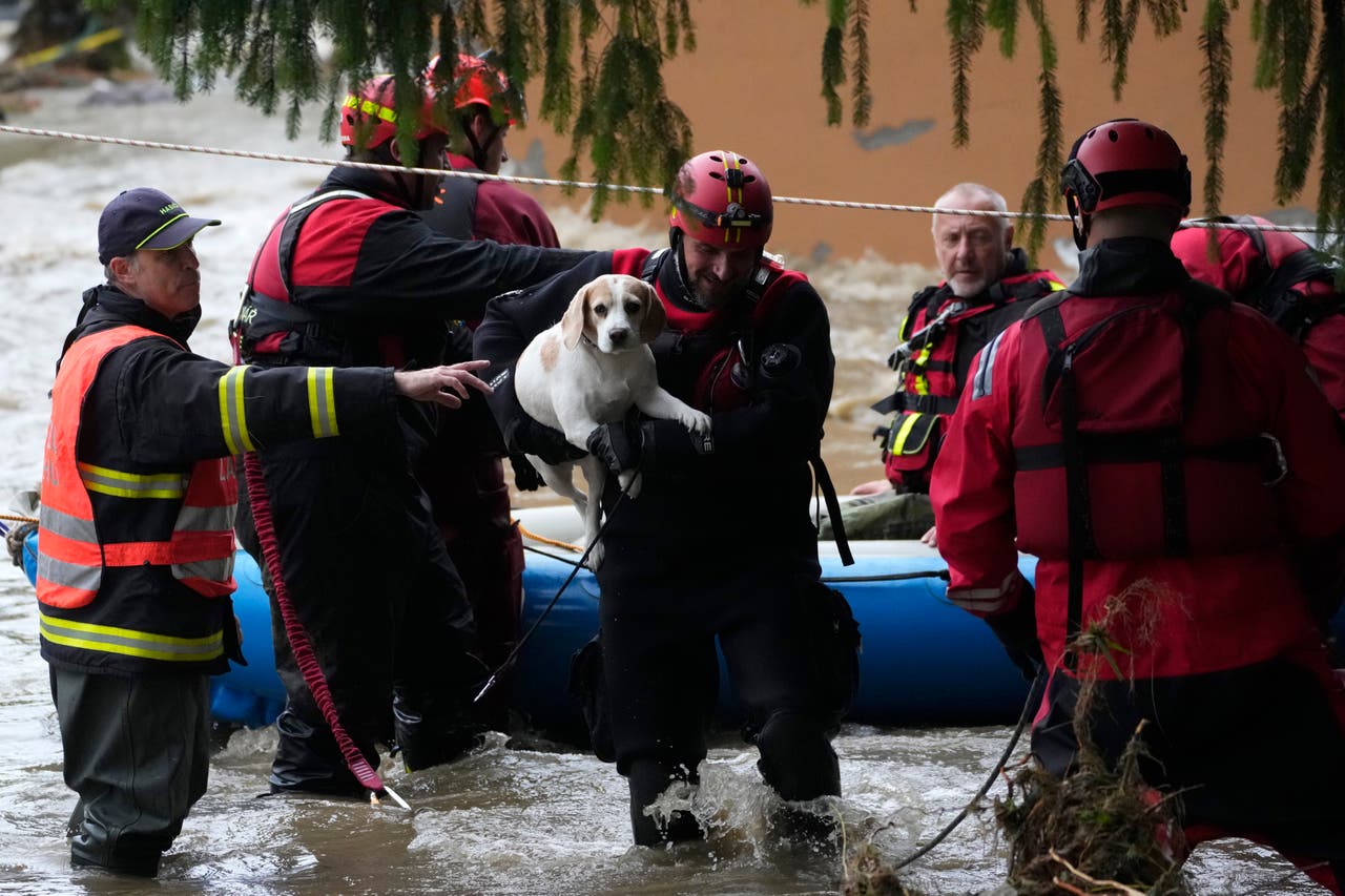 Death toll rises as rain and flooding force evacuations across central
