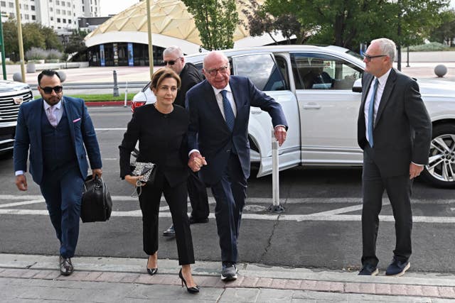 Rupert Murdoch, centre, and his wife Elena Zhukova Murdoch